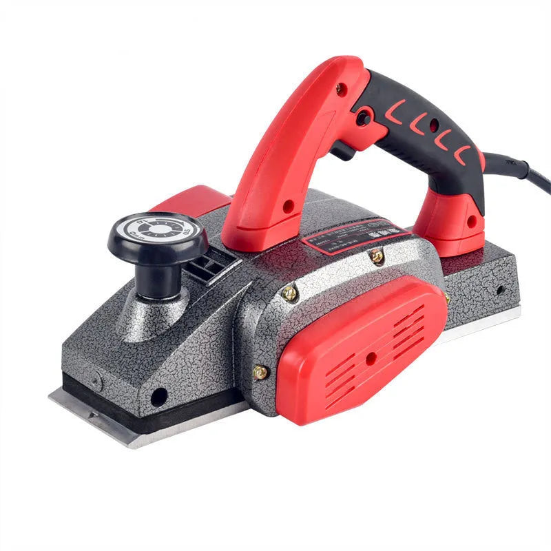 Red desktop electric wood planer with aluminium body showing 82mm cutting width