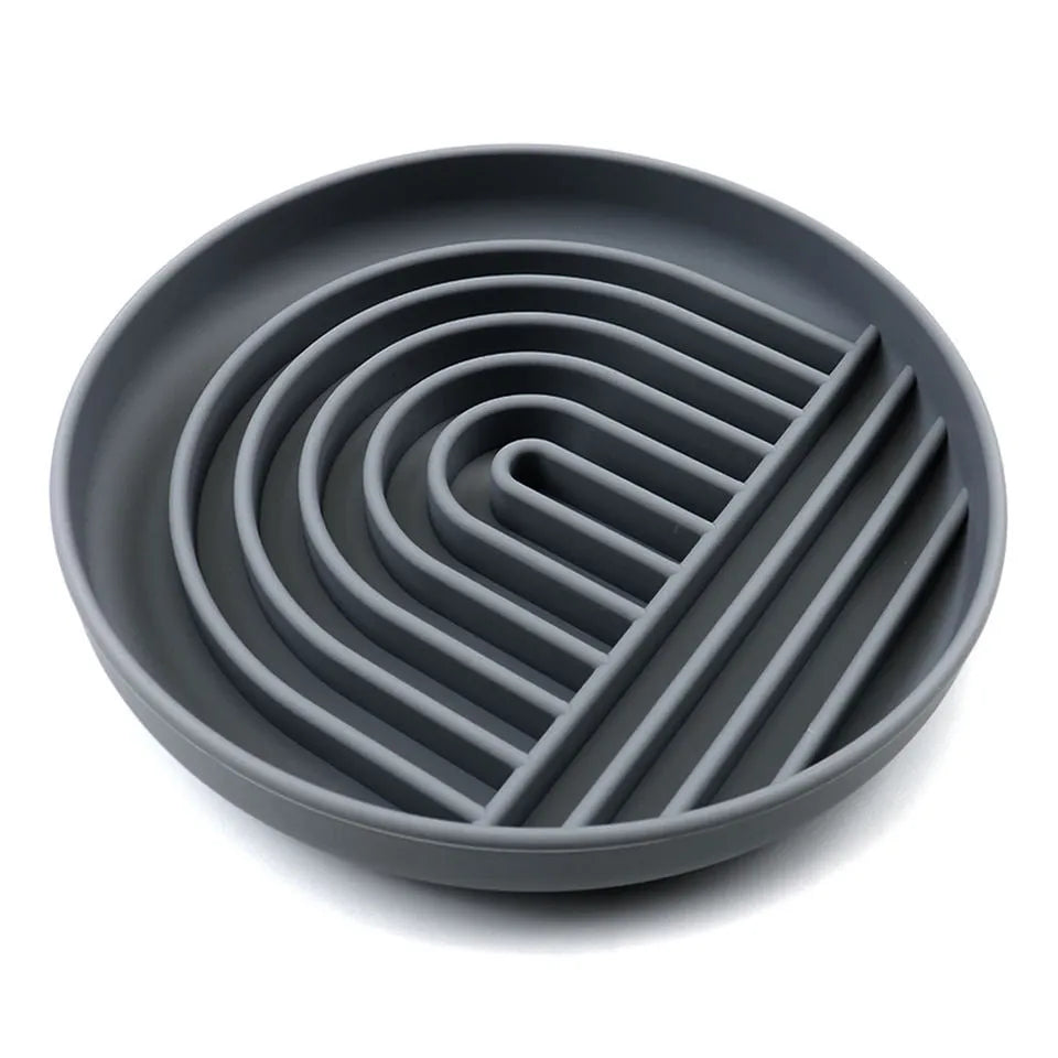 Silicone slow feeder dog bowl with textured ridges and nooks for slow eating, shown in assorted colours.