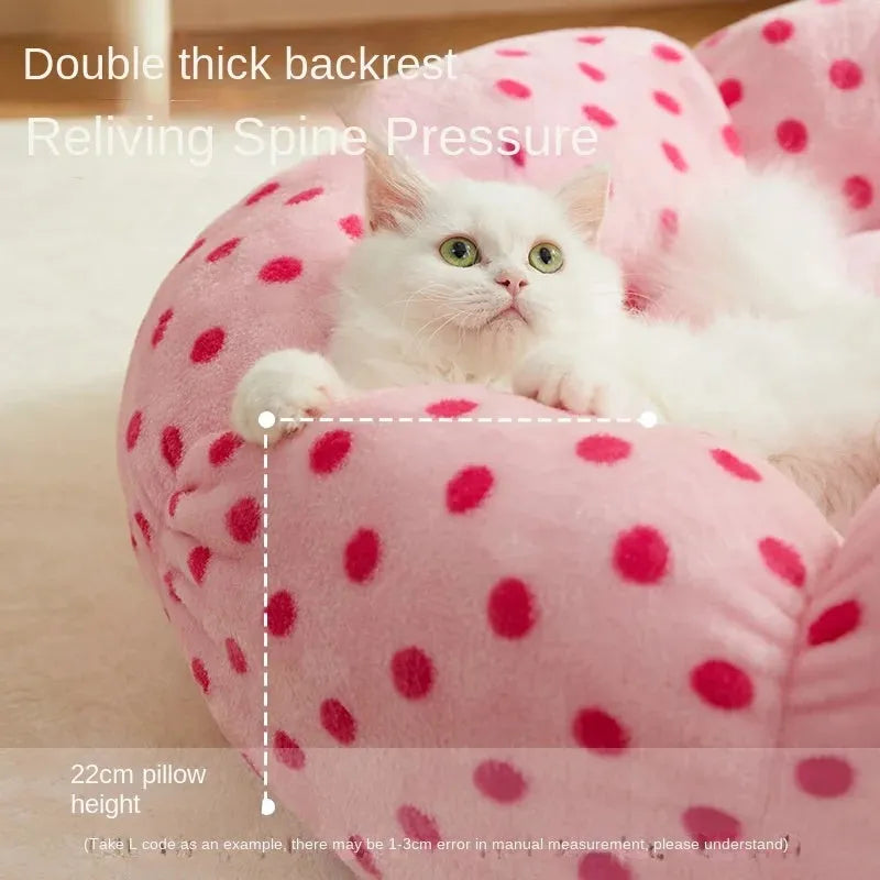 Round pink cat bed with dot pattern and cushion for indoor sleeping