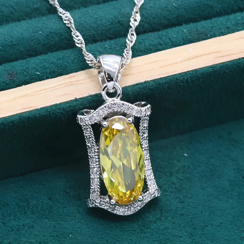 Olive and yellow anti-allergy alloy zircon jewellery set showing necklace, earrings, ring, and bracelet on a display.