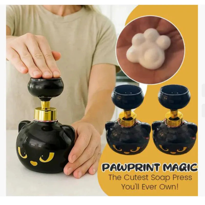 Black plastic cartoon cat-shaped foam soap dispenser measuring 10cm wide by 18cm tall
