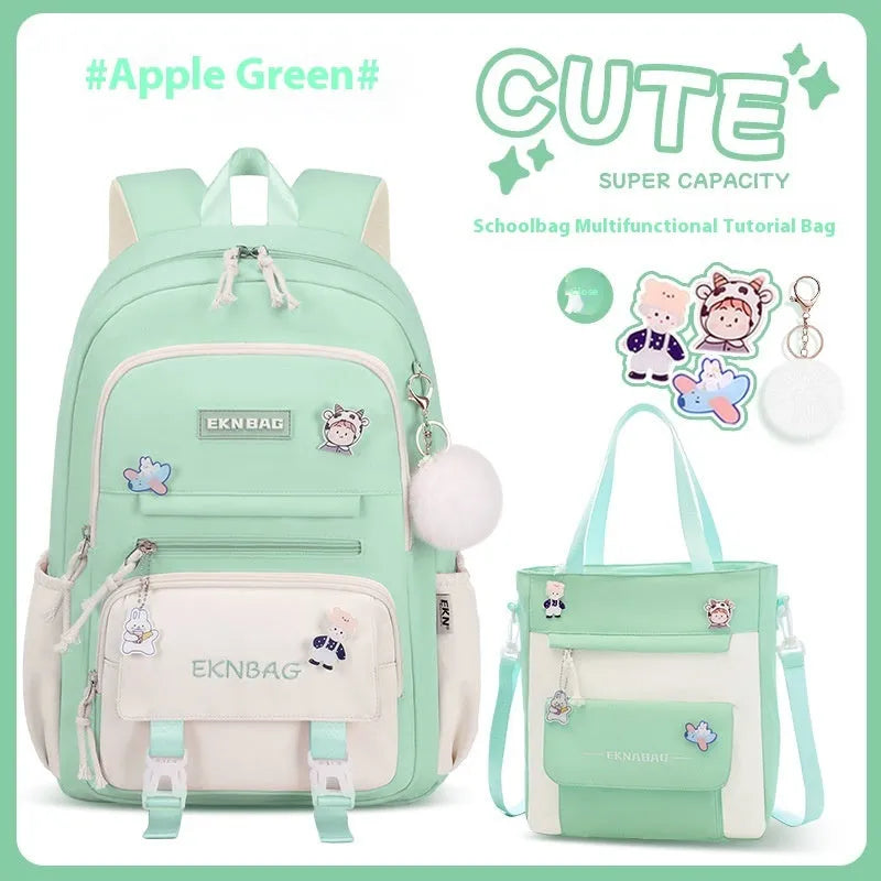 Pink waterproof Oxford cloth school backpack for girls with curved shoulder straps on a white background.
