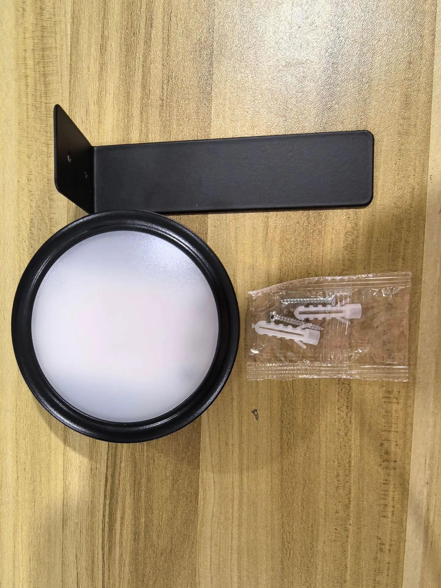 Wireless rechargeable LED painting lamp with magnetic belt attached to a metal frame, remote control nearby.