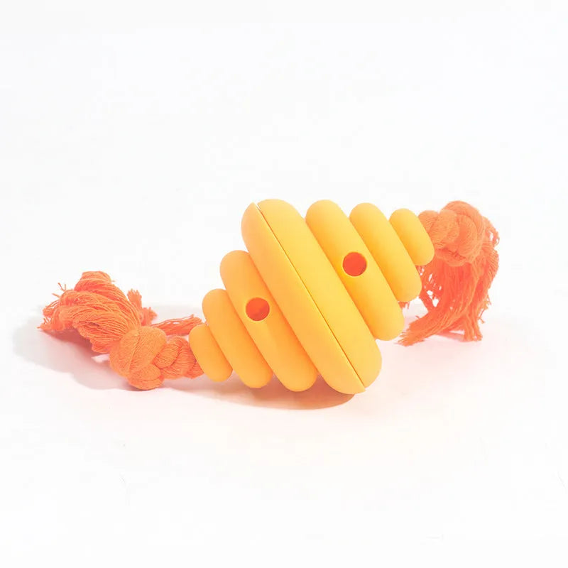 Green and yellow silicone dog ball with rope knot, showing spiral design for treat dispensing.