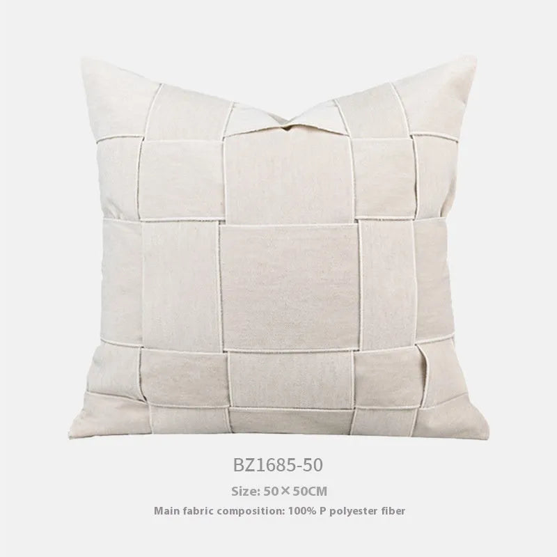 Square chenille woven cushion in beige colour on a grey sofa, 50x50cm size.