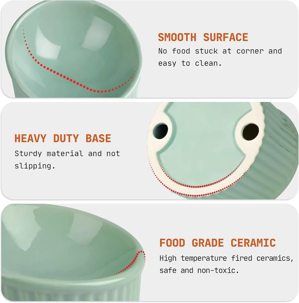 A dark green ceramic elevated cat bowl on a wooden surface, showing its tilted, round shape.