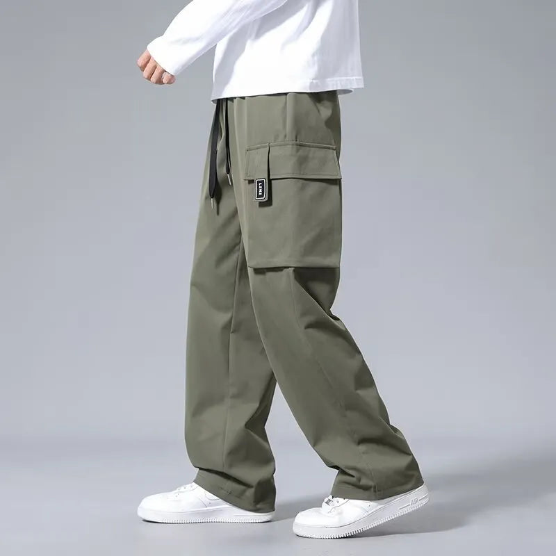 Boys' straight-leg cargo pants with large pockets and drawstring waist in army green colour