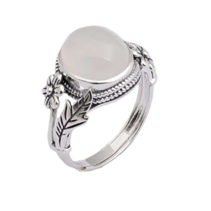 Adjustable copper vintage ring with white chalcedony stone and U-shaped band.