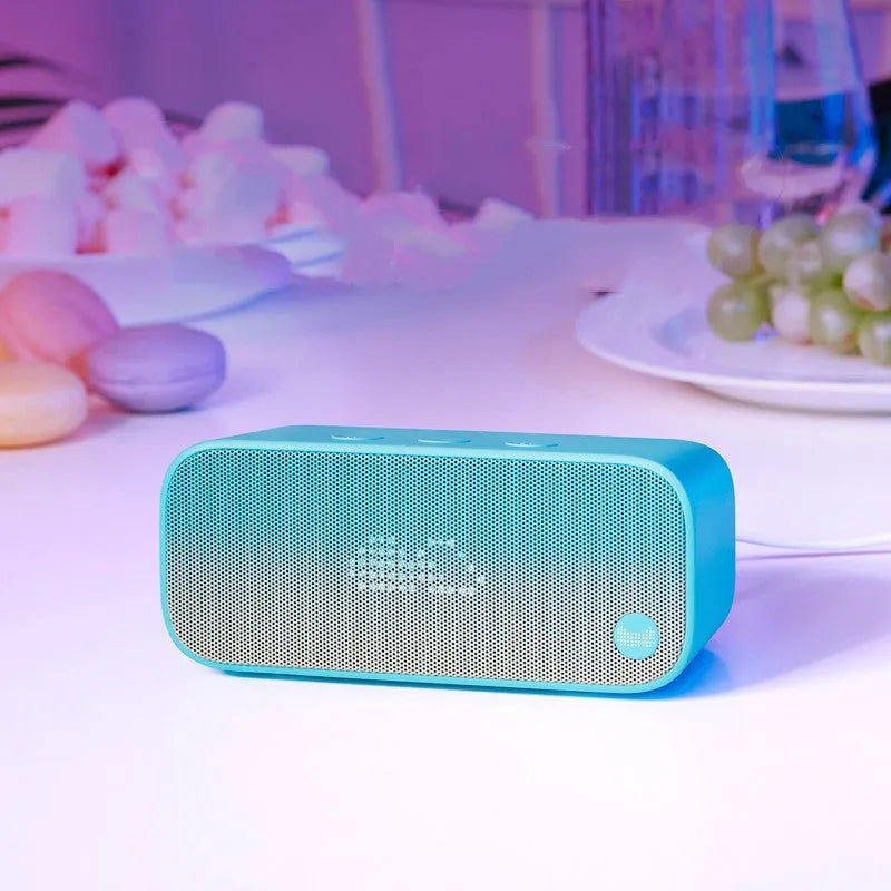 Elf sugar cube AI WiFi speaker in selected colour with front-facing design and compact bookshelf proportions