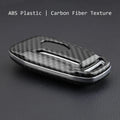 Hard plastic car key remote protective shell shown in single shell and buckle attachment variants