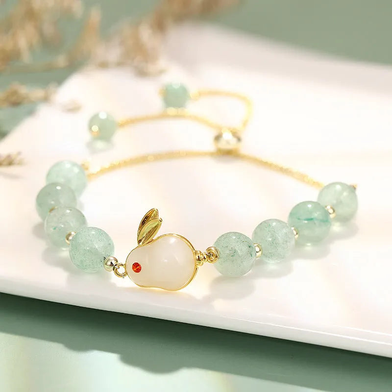Rabbit charm bracelet with green aventurine or strawberry quartz stones on gold-plated copper