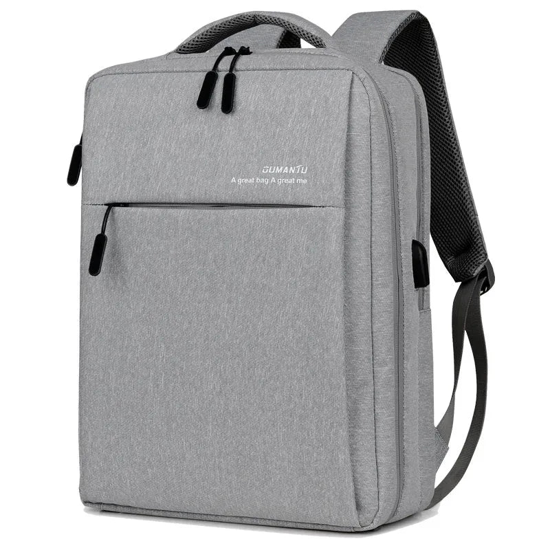 Waterproof rechargeable backpack laptop bag in black for a 15.6-inch computer.