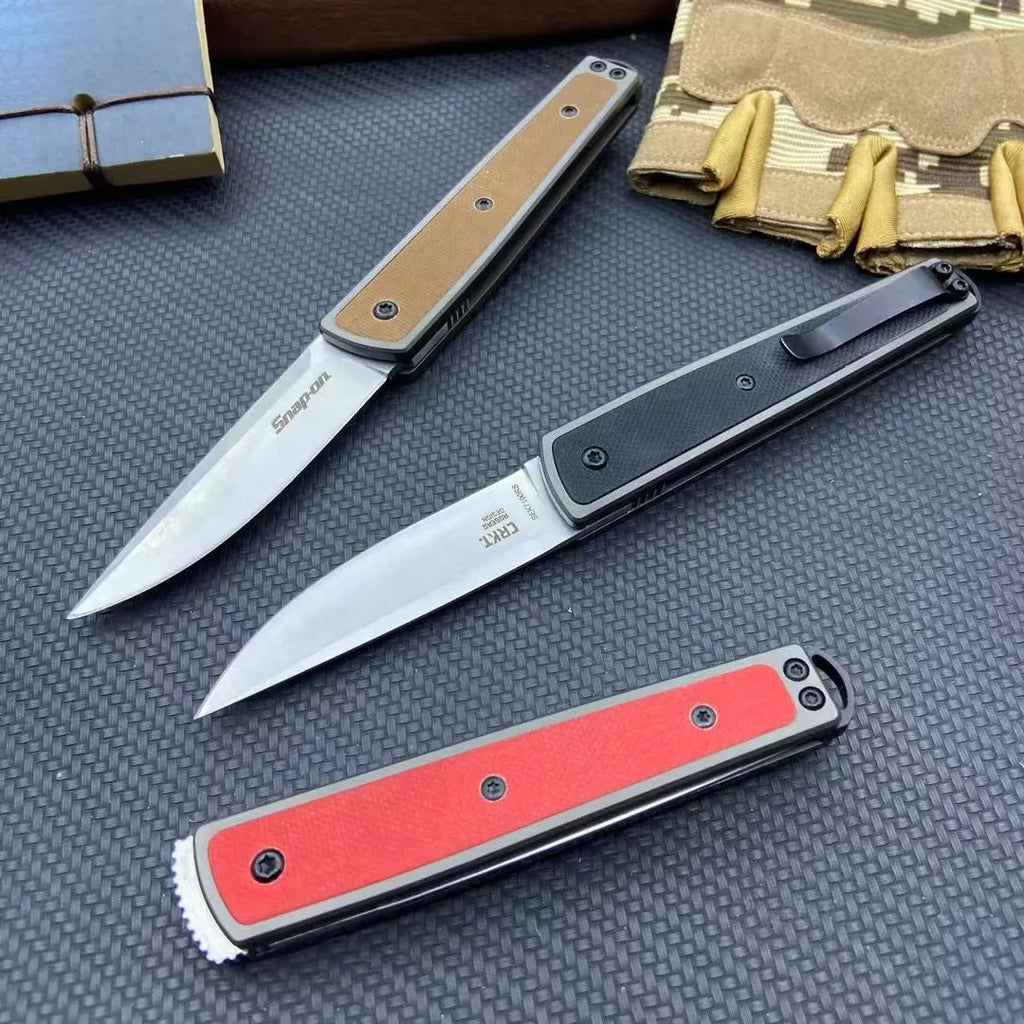 Folding fruit knife with stainless steel blade in black, brown, or red handle colours