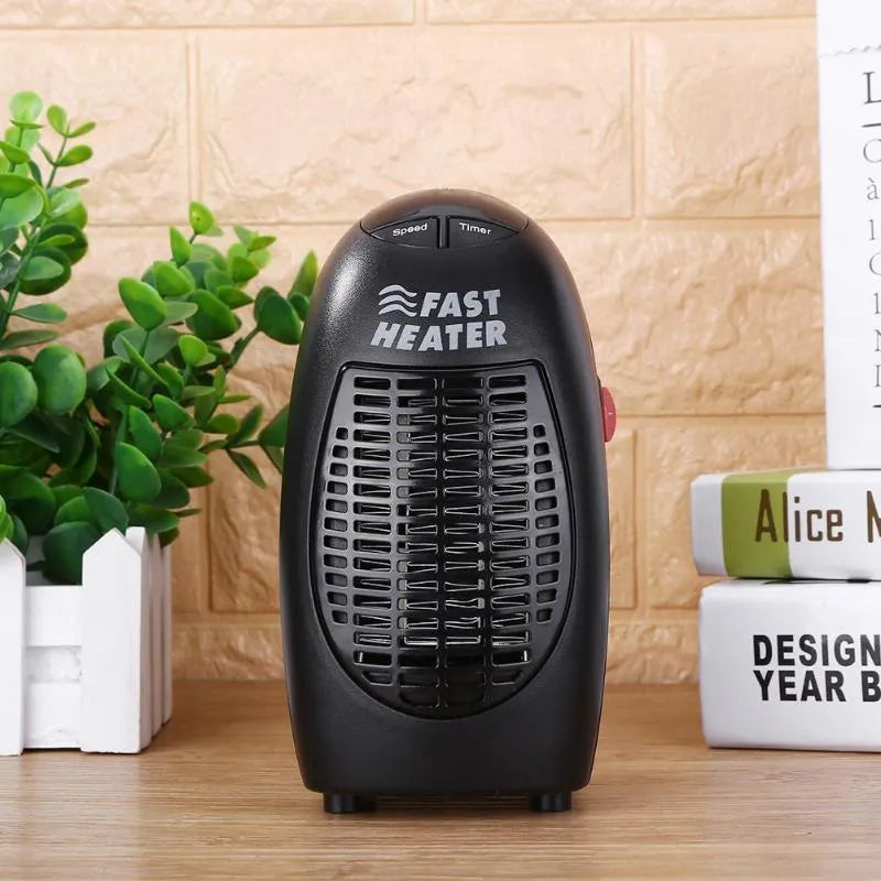 Compact black ceramic electric heater with digital display and rotating plug on a desk