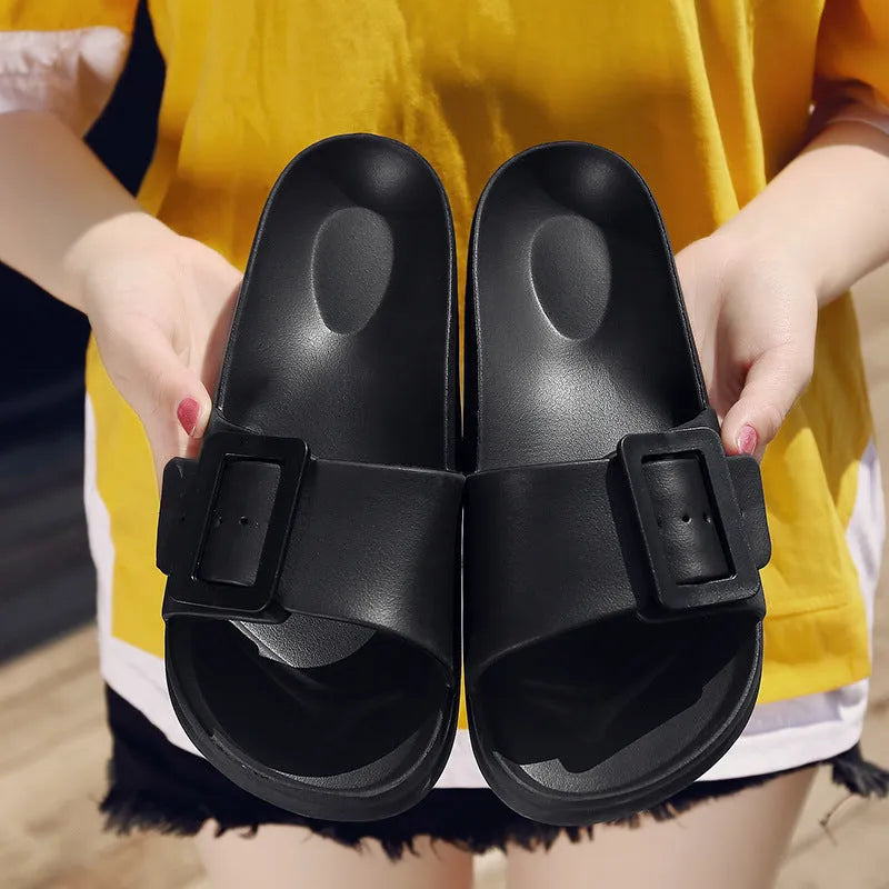 Women's grey blue flip-flop slippers with a buckle strap and soft EVA sole.
