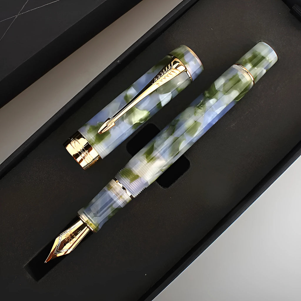 Deep bath green metal pen showing fine, medium, and graphic art tip options