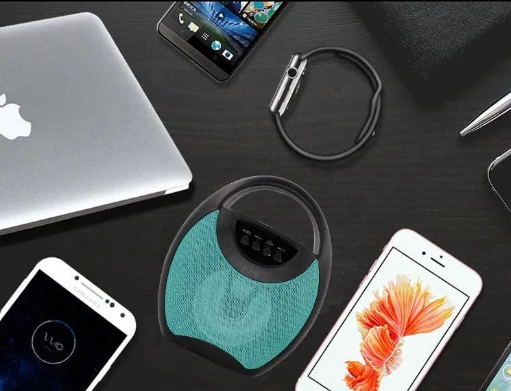 Portable Bluetooth speaker with plastic housing in black, blue, or pink colour options