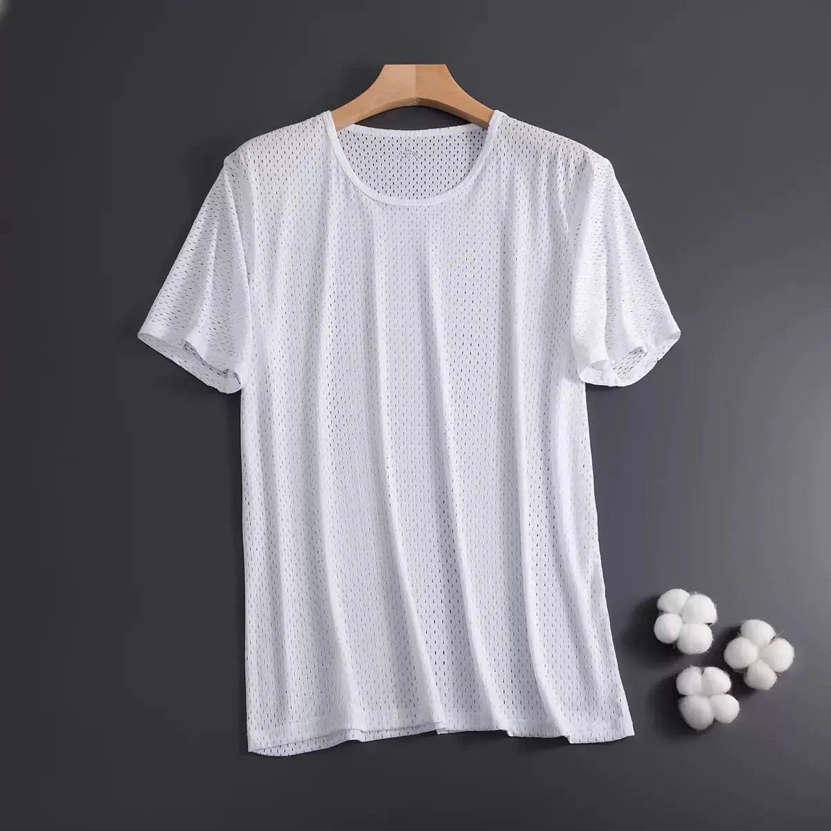 Man wearing a loose-fit grey Ice Silk short sleeve crew neck T-shirt.