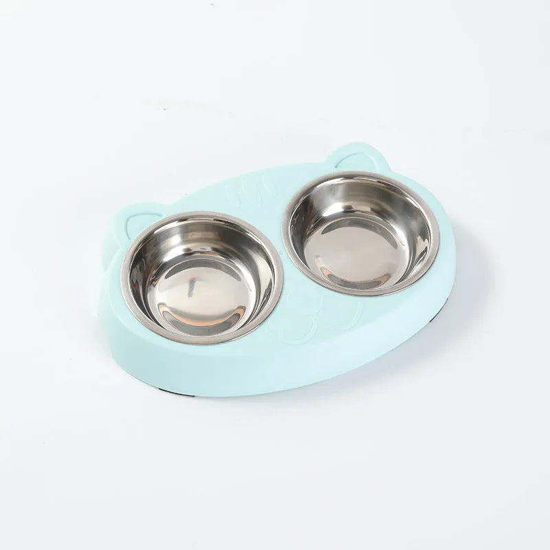 Blue plastic dual-bowl pet feeder tray for cat food and water on a white background.