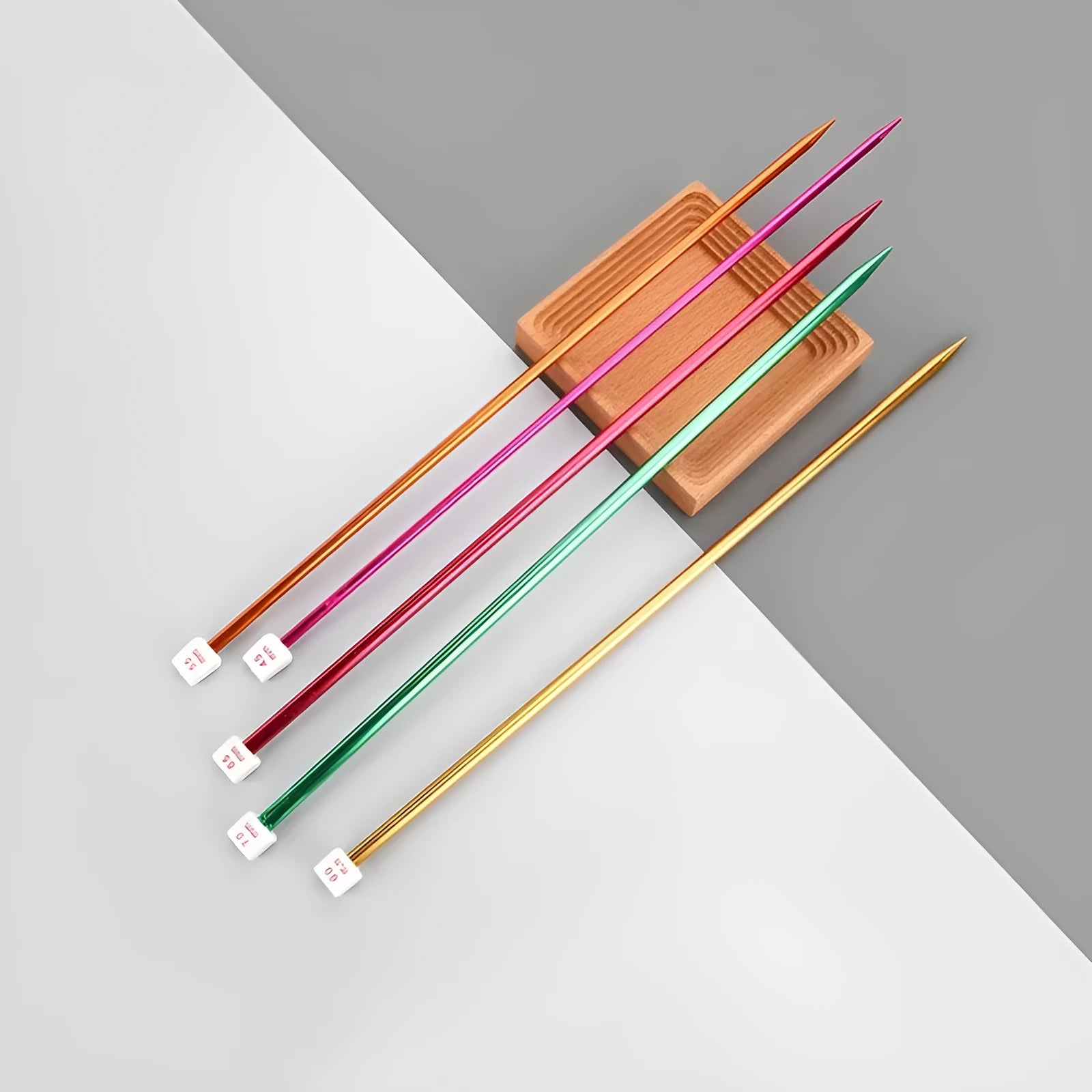 Crochet hook set showing 14 different sizes from 2.0mm to 10.0mm with lengthened design and caps