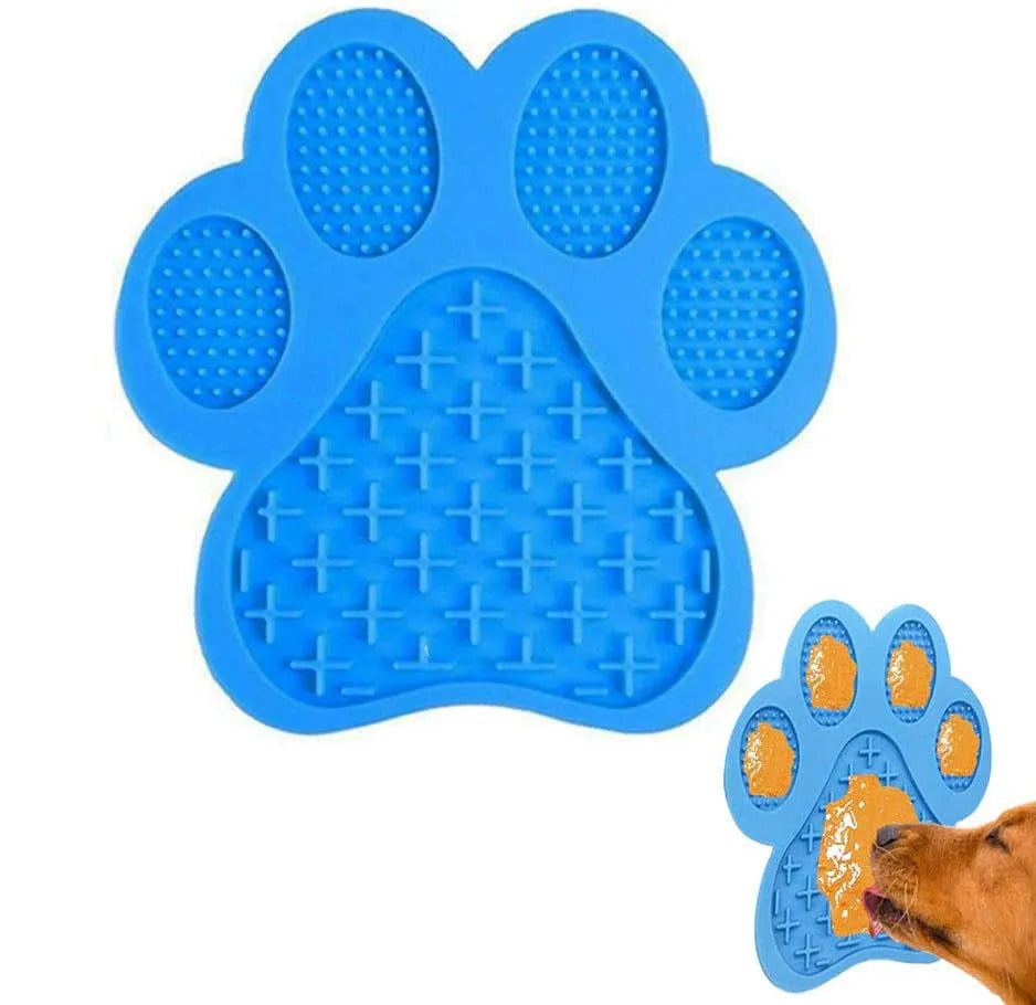 Blue bone-textured silicone dog licking mat with suction cups on back, shown on a tiled wall.