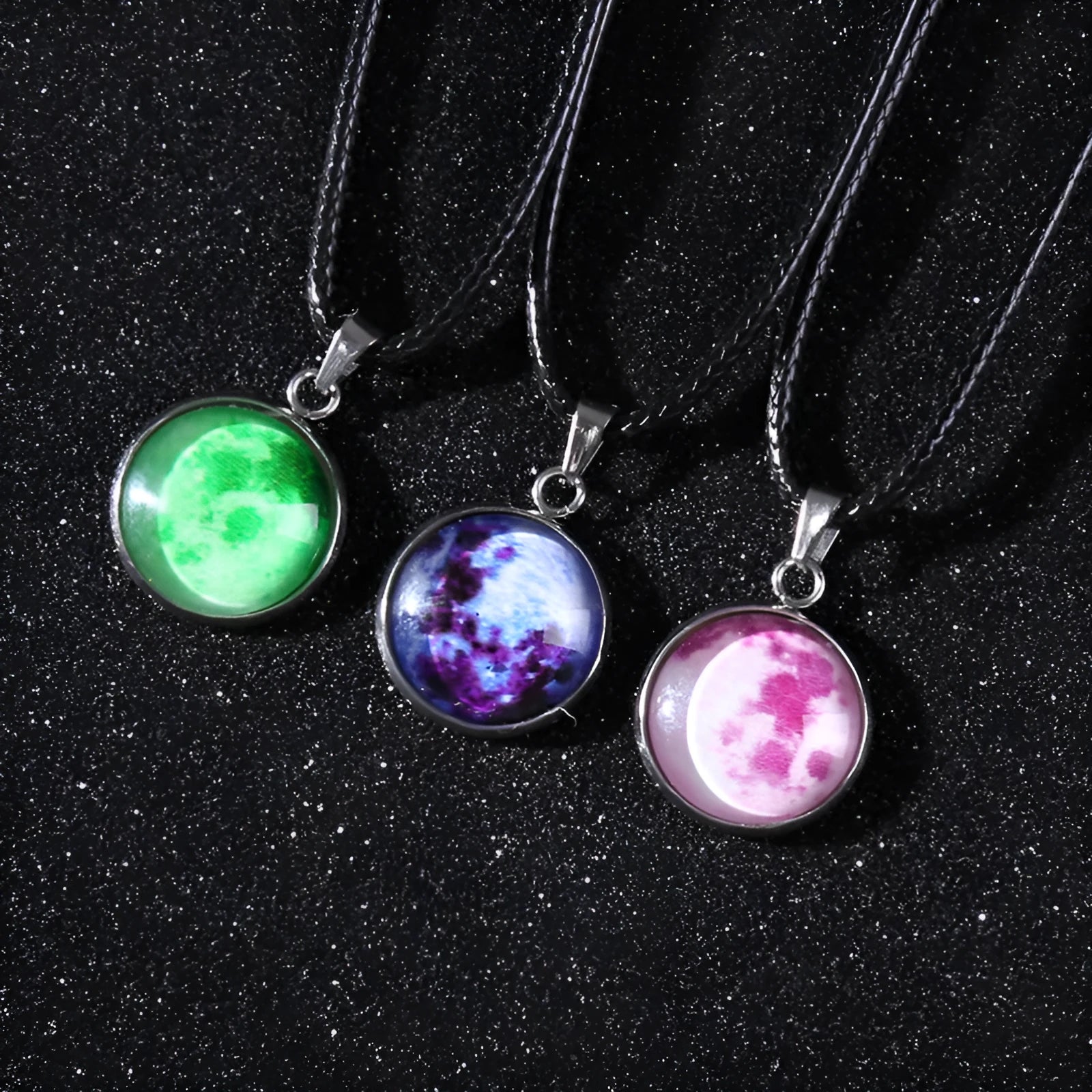 Luminous constellation pendant necklace with adjustable chain on a plain background.