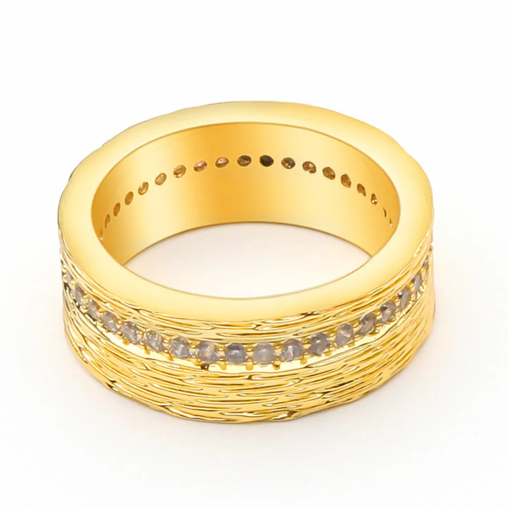 Gold colour geometric women's ring with a zircon stone on a copper band.