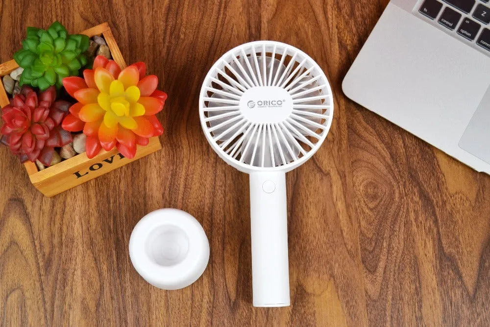White ORICO FH1 portable USB desk fan with fine line design on a desktop.