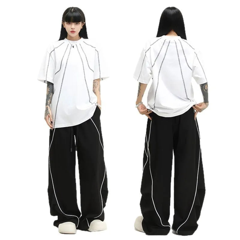 Black striped pleated hip hop wide-leg trousers with mid waist on mannequin