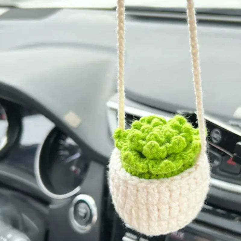 Green and white knitted rope car plant ornament with 8cm base and hanging rope.