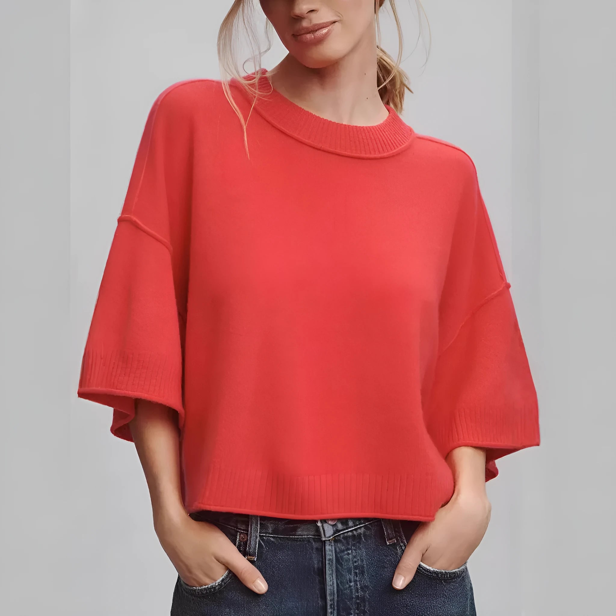 Red hot girl style viscose t-shirt with short sleeves and an exposed navel cut on a mannequin.