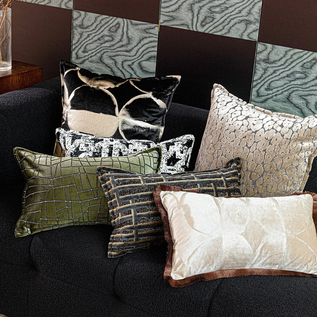 Black gold abstract pattern decorative flannel cushion on a sofa, showing removable cover.