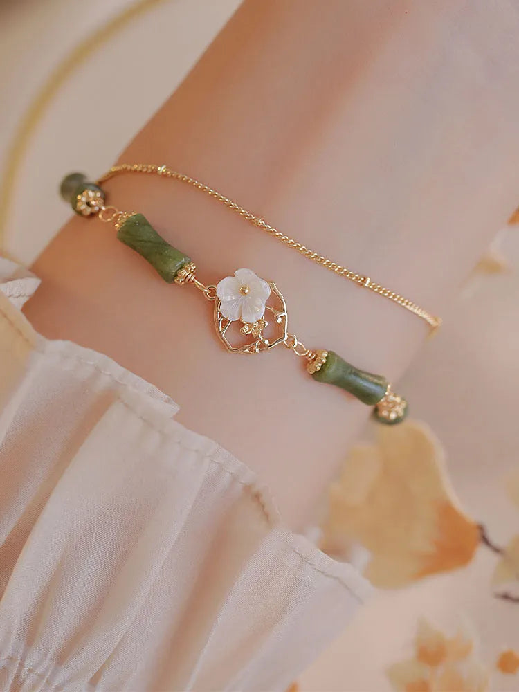 Natural olivine stone bracelet with Chinese double layer design and Bells of Ireland charms