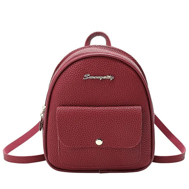 Women's small black PU leather backpack letter purse with shoulder strap measuring 18.5cm long