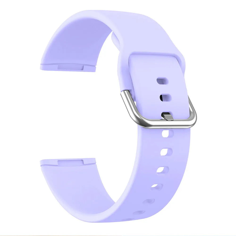 Solid colour silicone replacement strap with silver buckle for Fitbit Versa 3 and Sense 2 fitness trackers.