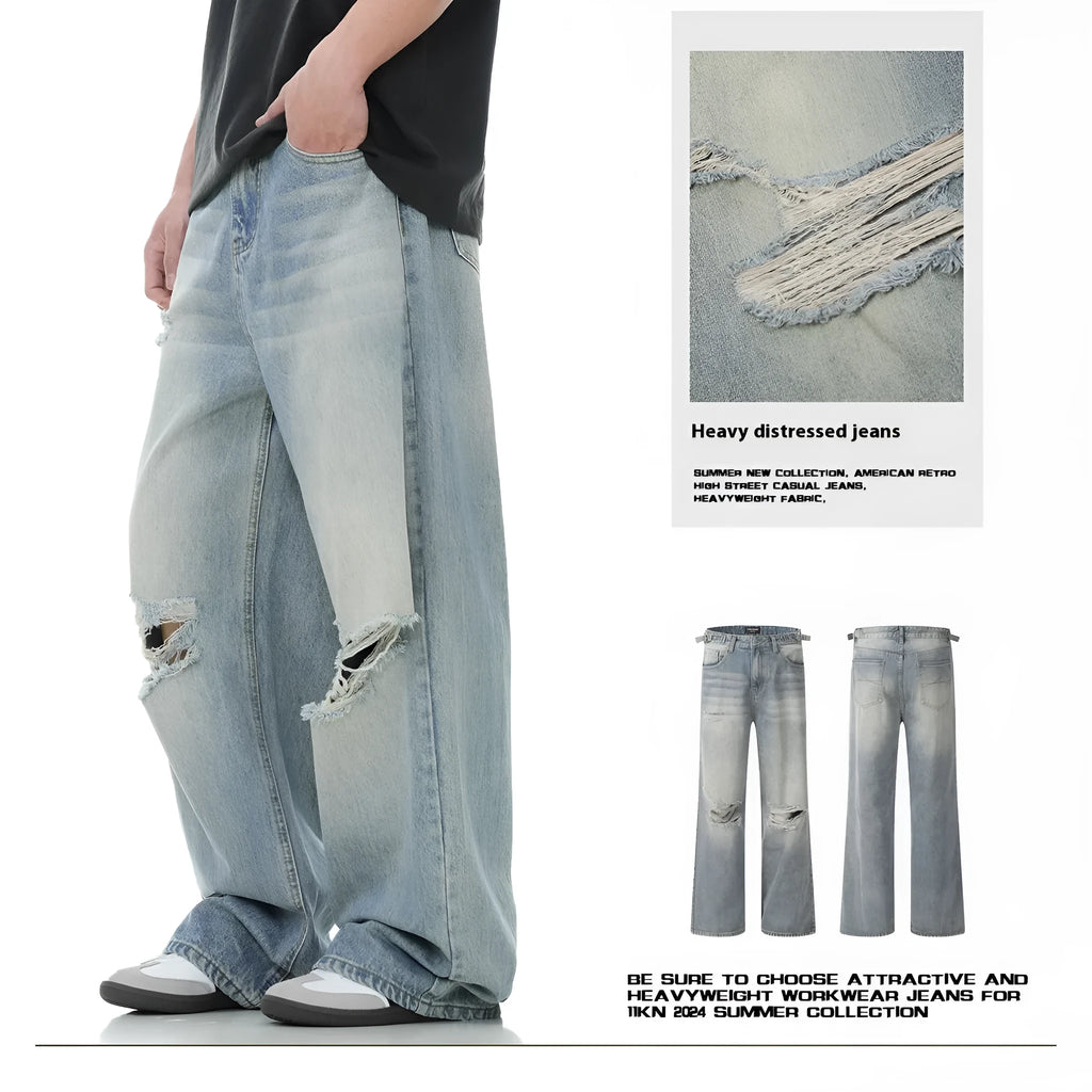 Blue men's straight-leg jeans with ripped distressing on the thigh, showing five-pocket design and zip fly.