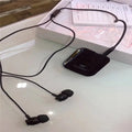Black Bluetooth audio receiver headset with lavalier microphone for wireless calls and music