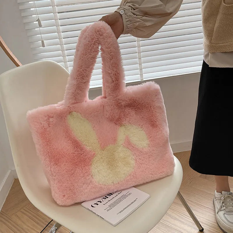 Plush shoulder bag with cartoon rabbit ears design in solid colour options