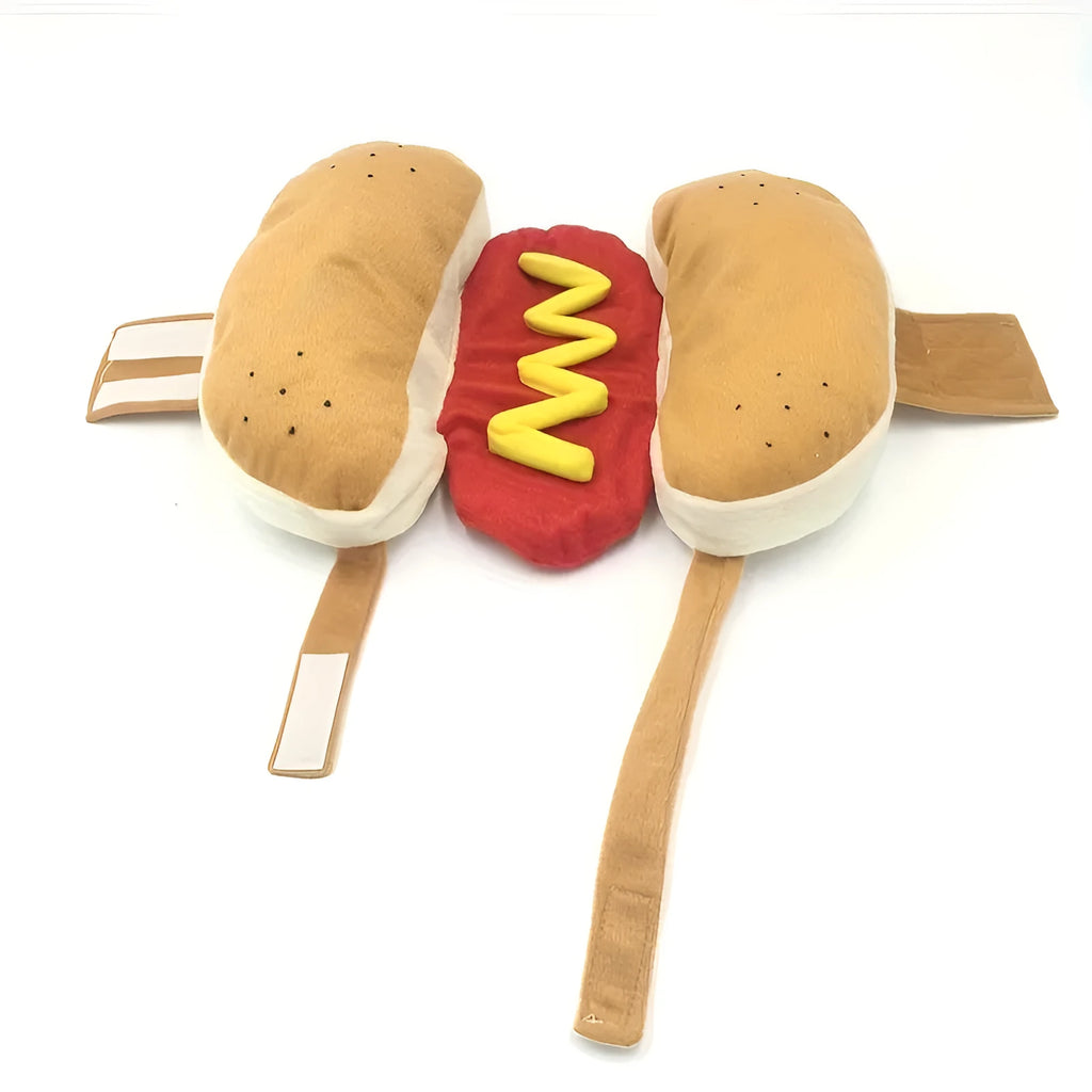 Small dog wearing a stuffed brown and beige hot dog costume with bun.