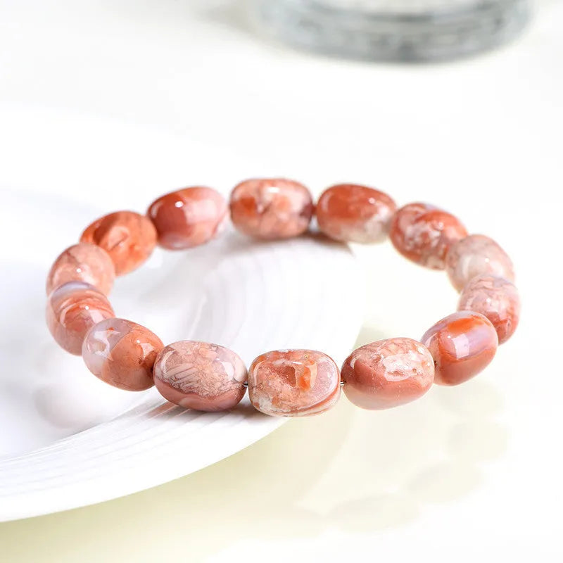 Natural cherry agate barrel bead bracelet with 10x14mm geometry and Ruyi design elements