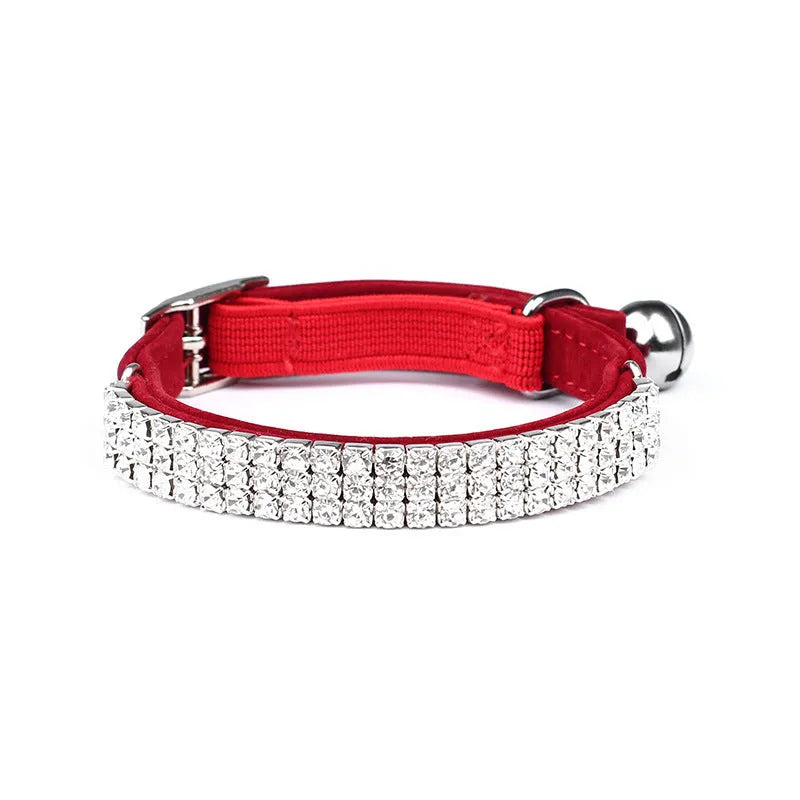 Soft red velvet cat collar with rhinestones, shown adjusted to fit.
