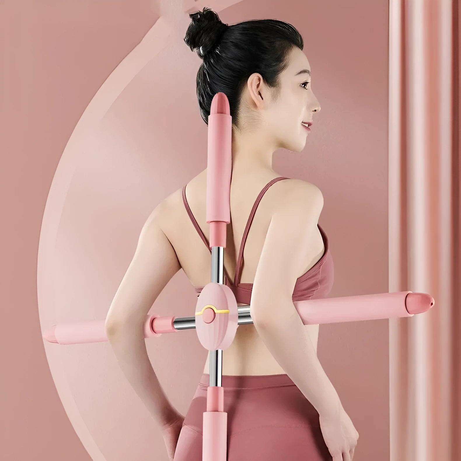 Children's adjustable open back stick in pink colour showing length adjustment mechanism