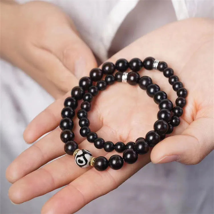 Ebony bracelet with Tibet beads design showing two-tone colour circles and 8mm diameter