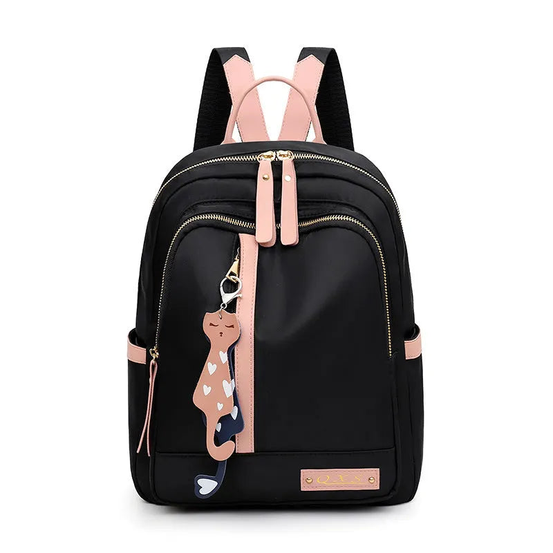 Women's black nylon backpack with double shoulder straps and organisational compartments