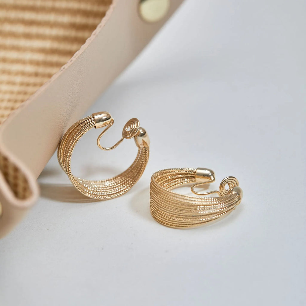 Geometric copper stud and clip earrings in gold and silver electroplated colours with simple multi-layer design