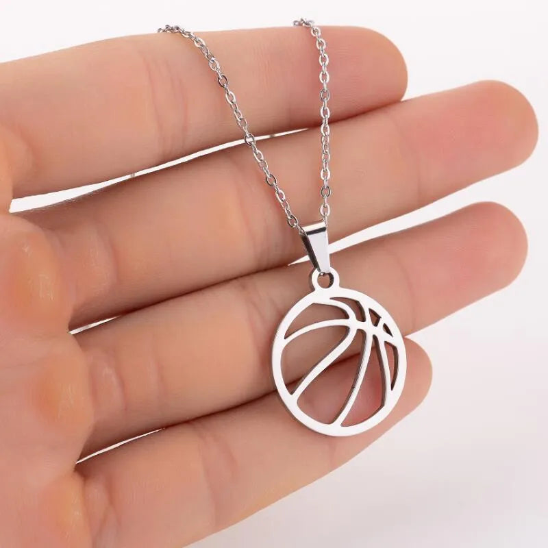 Gold stainless steel volleyball pendant necklace on display with chain and 3cm extender