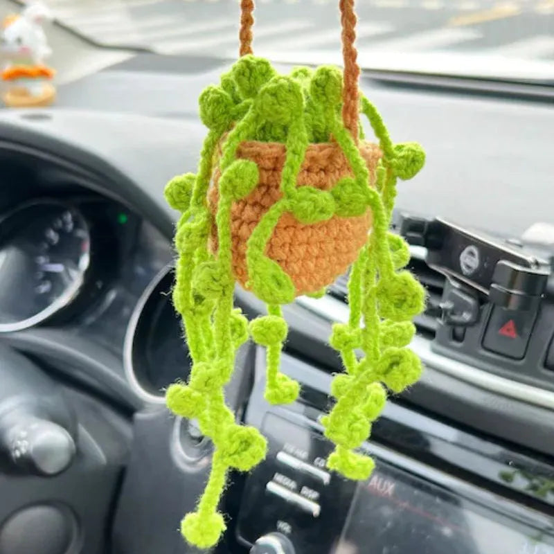 Green and white knitted rope car plant ornament with 8cm base and hanging rope.