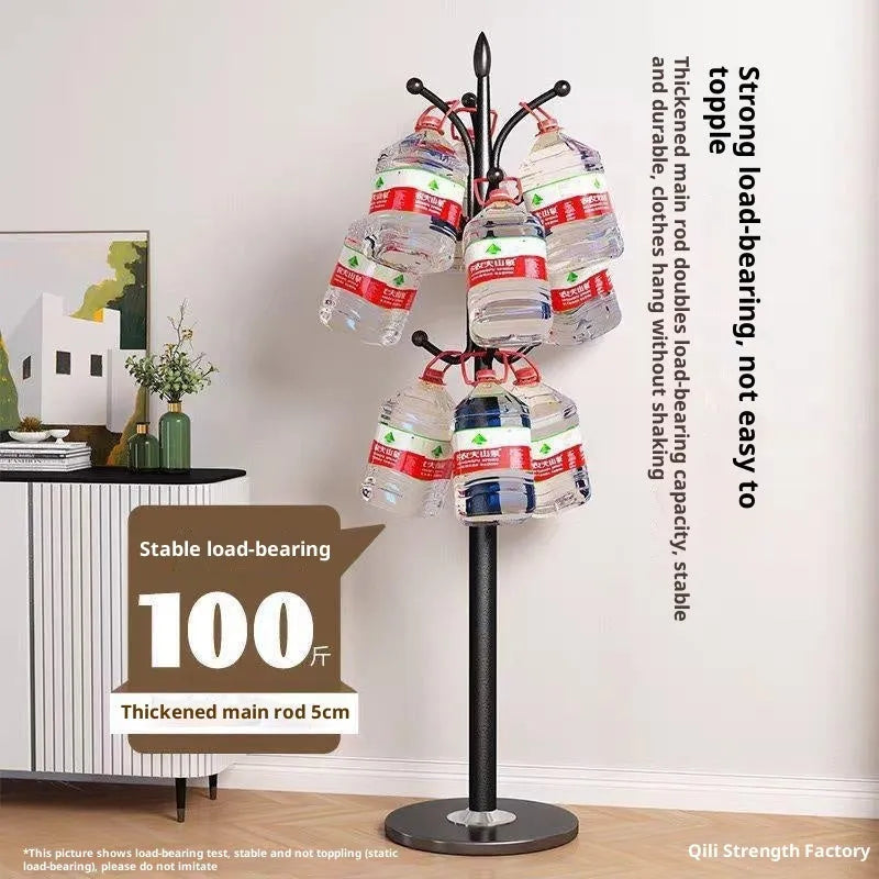 Floor-standing iron coat rack in black with vertical metal frame for hanging jackets and bags in a bedroom or hallway