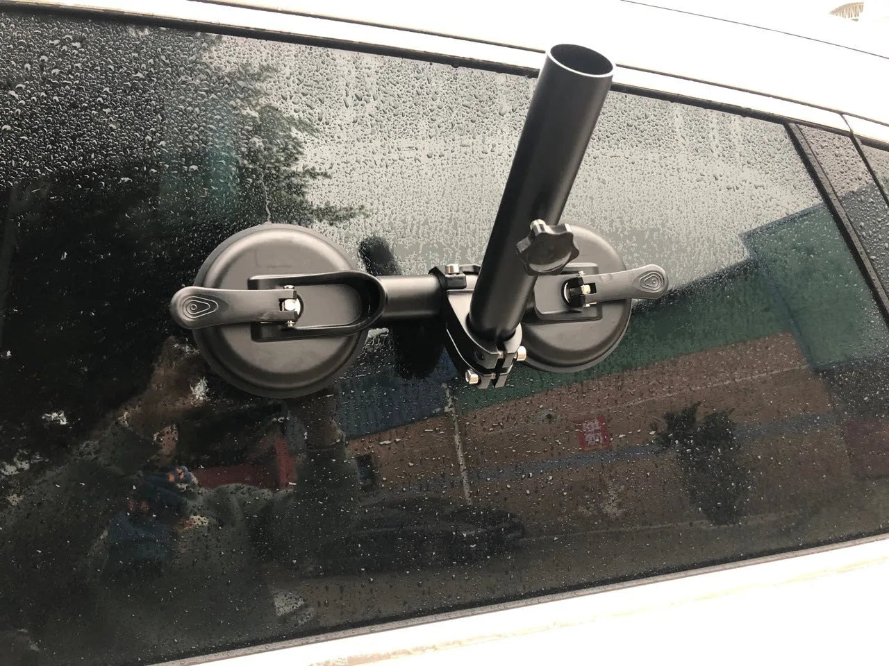 Black off-road car flagpole sucker base with round glass suction cup and rubber disc.