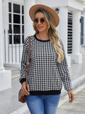 Black Japanese plaid pattern long sleeve polyester pullover sweater on a hanger